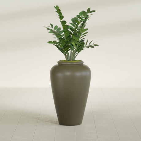 Barà Jar fiberglass planter in Matte Bronze, shown planted, in a sunlit interior