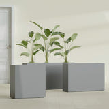 Milano Narrow Rectangular fiberglass planter in Matte Gunmetal, shown planted, in a sunlit interior