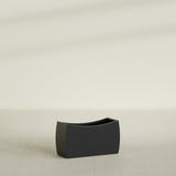 Seoul Curved Planter in Matte Black, 32"L × 12"D × 18"H, shown empty