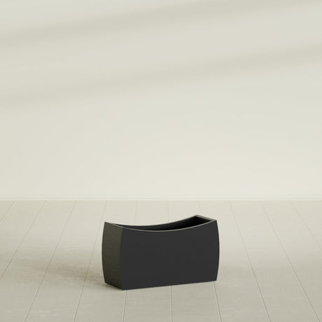 Seoul Curved Planter in Matte Black, 32"L × 12"D × 18"H, shown empty