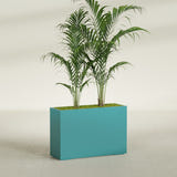 Potsdam Corner fiberglass planter in Satin Seafoam Green, shown planted, in a sunlit interior