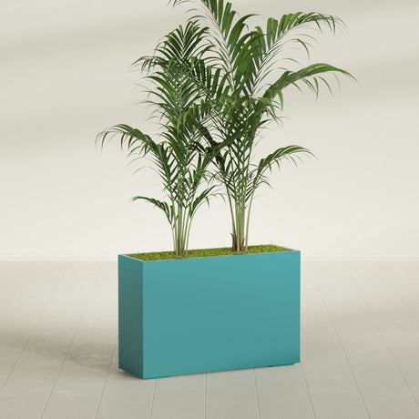 Potsdam Corner fiberglass planter in Satin Seafoam Green, shown planted, in a sunlit interior