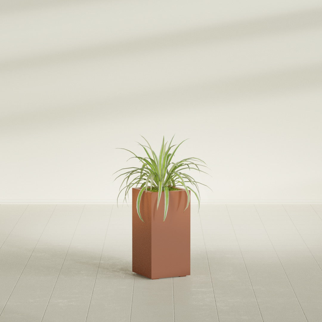 Hollywood Corner fiberglass planter in Matte Terra Cotta, shown planted, in a sunlit interior