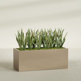 Granada rectangular fiberglass planter in Gloss Metallic Gold, 60 × 24 × 24 in, shown planted in a room