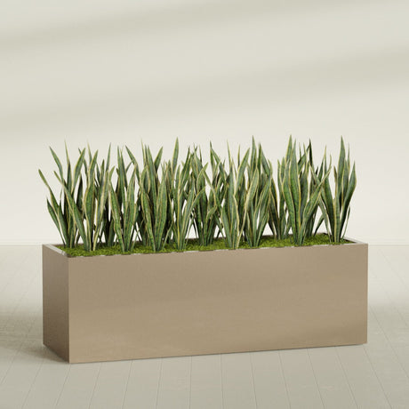 Granada rectangular fiberglass planter in Gloss Metallic Gold, 72 × 24 × 24 in, shown planted in a room