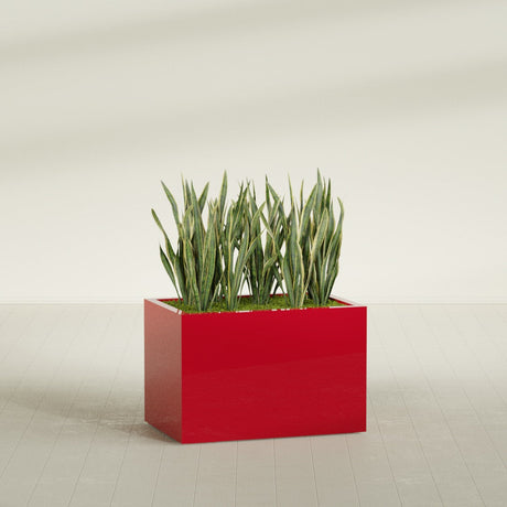 Granada rectangular fiberglass planter in Gloss Red, 36 × 24 × 24 in, shown planted in a room