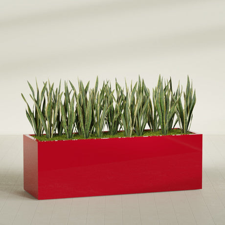 Granada rectangular fiberglass planter in Gloss Red, 72 × 24 × 24 in, shown planted in a room