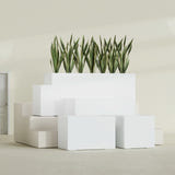 Granada rectangular fiberglass planter in Matte Bright White, all four lengths shown together, 36 to 72 in long