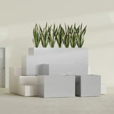 Granada rectangular fiberglass planter in Metallic Silver, all four lengths shown together, 36 to 72 in long