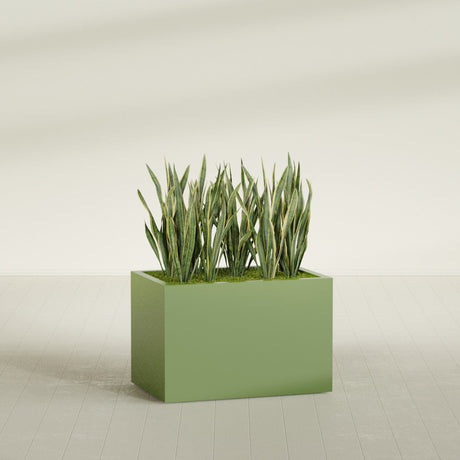 Granada rectangular fiberglass planter in Satin Green, 36 × 24 × 24 in, shown planted in a room