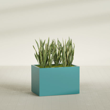Granada rectangular fiberglass planter in Satin Seafoam Green, 36 × 24 × 24 in, shown planted in a room