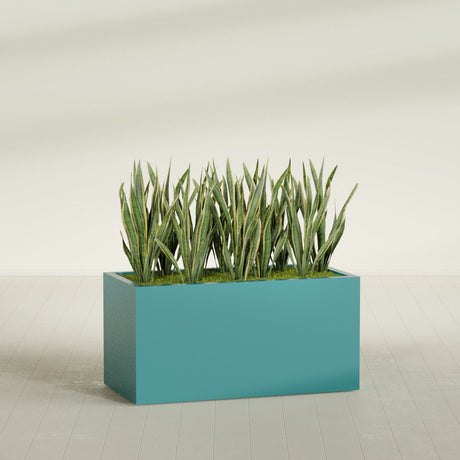 Granada rectangular fiberglass planter in Satin Seafoam Green, 48 × 24 × 24 in, shown planted in a room
