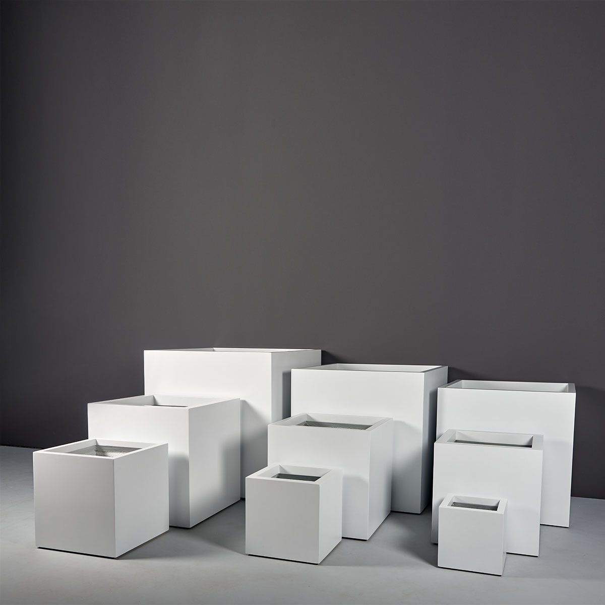 Montroy cube fiberglass planter, the full size range grouped together