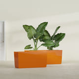 Panama tapered fiberglass planter in Gloss Tangerine, 36"L × 12"D × 18"H, shown empty