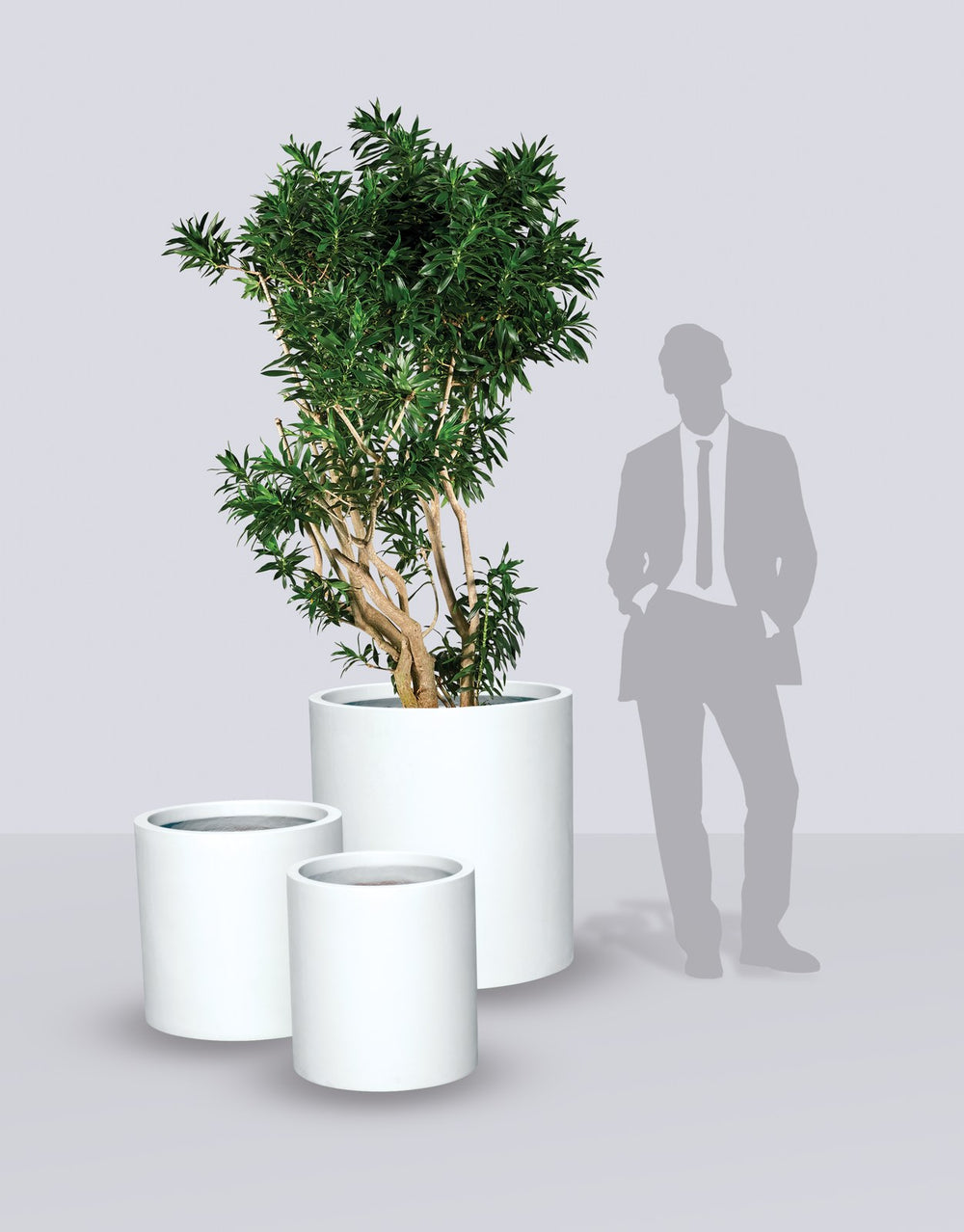 Rio Grande Cylinder fiberglass planter size range shown to scale beside a standing figure
