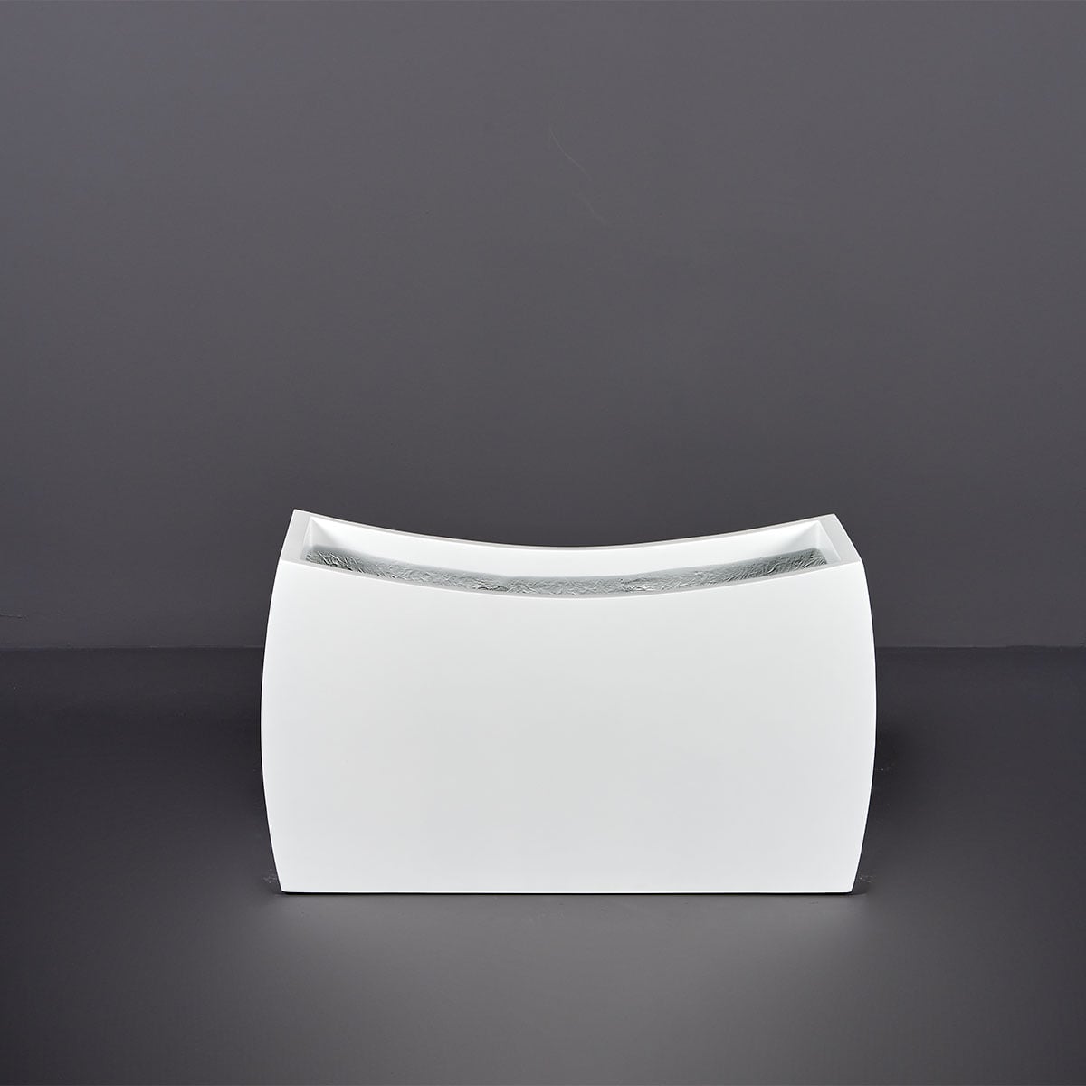 Seoul curved rectangular fiberglass planter, shown empty, front view showing the bow-front curve