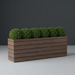 Siena fiberglass planter in Woodland, planted with row of clipped boxwood balls, studio