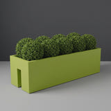 Tiergarden Railing fiberglass planter in Satin Green, planted with row of clipped boxwood balls, studio