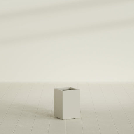 Tolga corner fiberglass planter in Matte Cement Grey (shown in Satin Beige; color approximate)