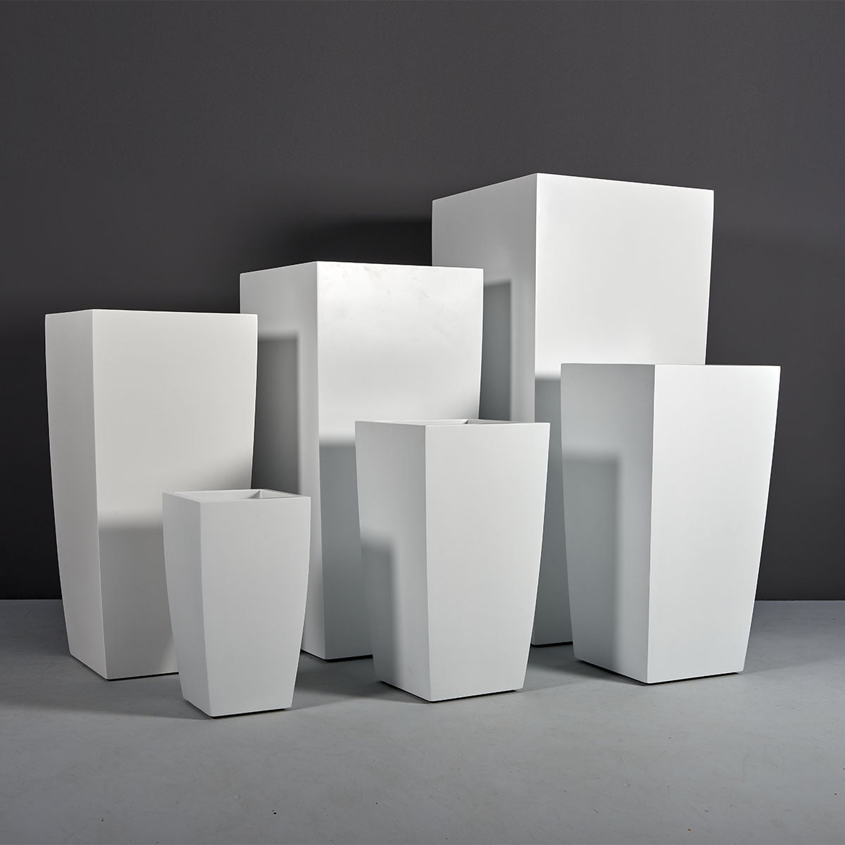 Toulan tall tapered square fiberglass planter, the full size range grouped together