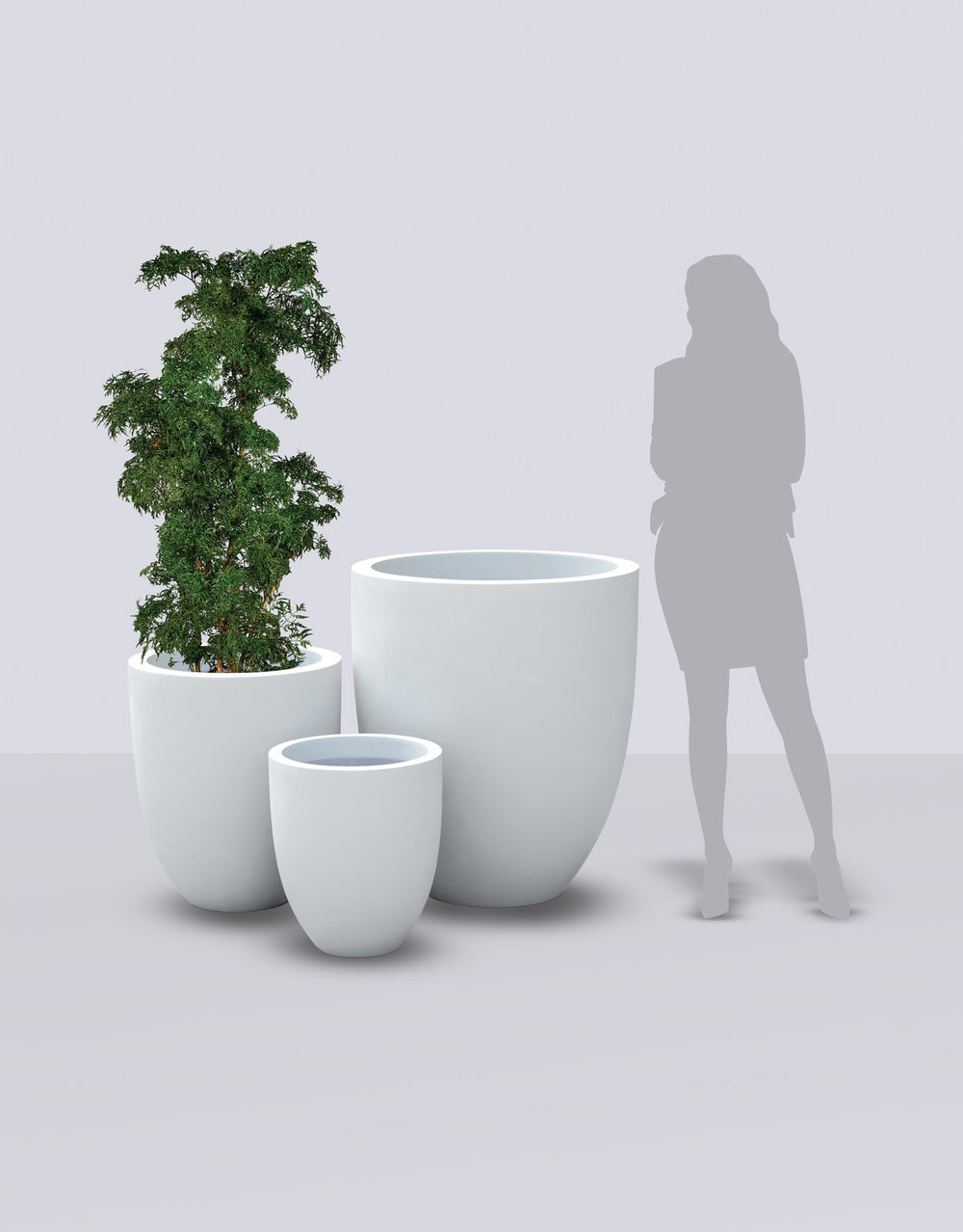 Valencia Tapered Round fiberglass planter size range shown to scale beside a standing figure