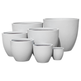 Wannsee round fiberglass planter shown in all sizes side by side in a studio render for comparing sizes: D 15 in × 13 in, D 22 in × 19 in, D 27 in × 24 in, D 33 in × 29 in, D 39 in × 34 in, D 44 in × 39 in, D 50 in × 44 in